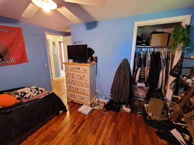 7412 N Webster Rd, Mount Morris, MI 48458 - bedroom with wood finished floors, ceiling fan, and a closet