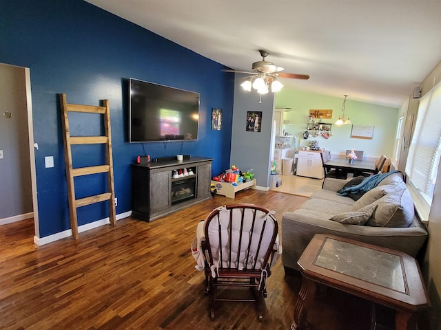 living room with ceiling fan, lofted ceiling, and wood-type flooring