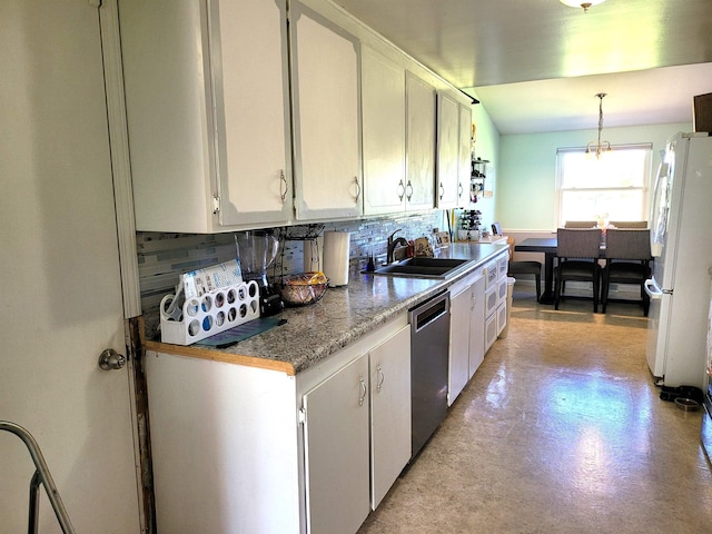 7412 N Webster Rd, Mount Morris, MI 48458 - kitchen featuring a sink, stainless steel dishwasher, decorative backsplash, and freestanding refrigerator
