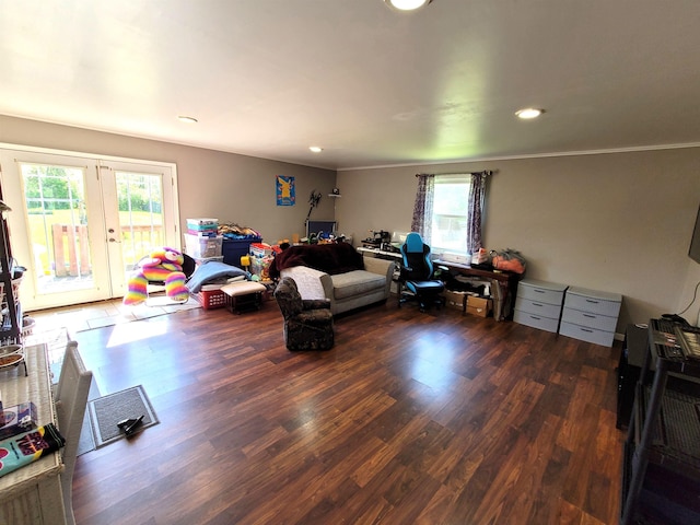 living room with crown molding, french doors, and dark hardwood / wood-style flooring