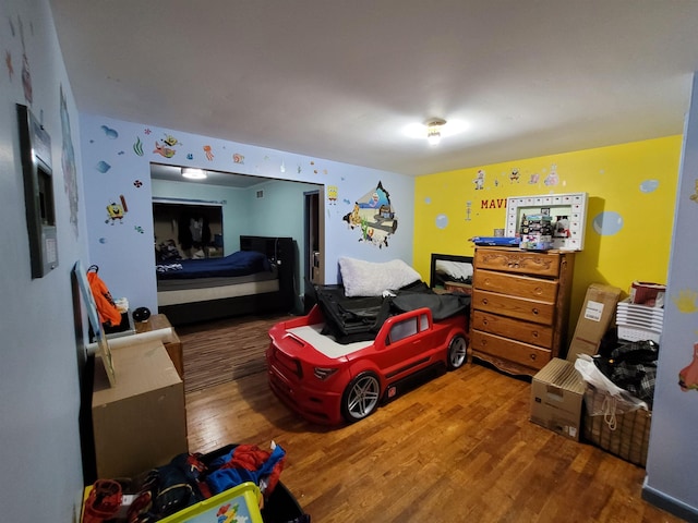 bedroom featuring hardwood / wood-style flooring