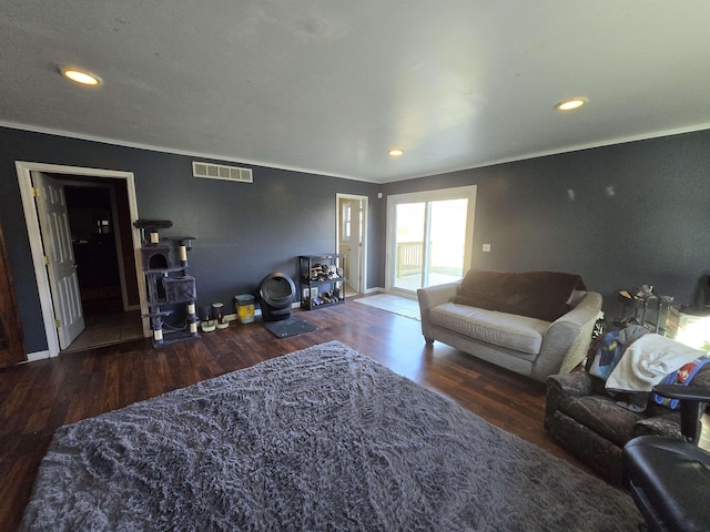 7412 N Webster Rd, Mount Morris, MI 48458 - living room with recessed lighting, wood finished floors, ornamental molding, visible vents, and a wood stove