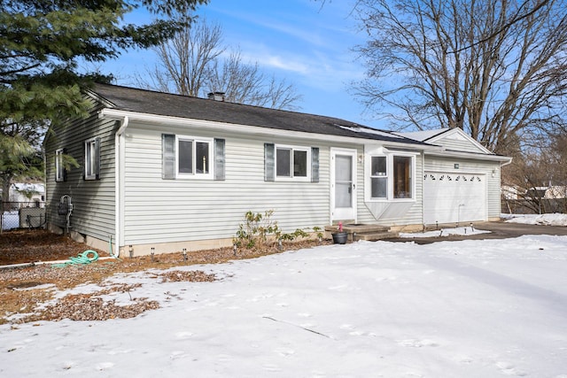 single story home with a garage