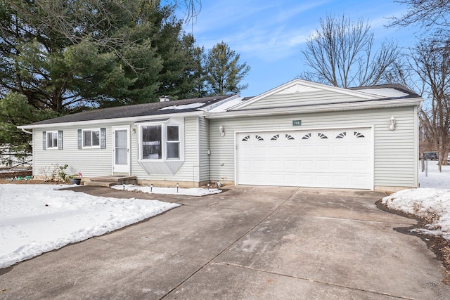 ranch-style house featuring a garage