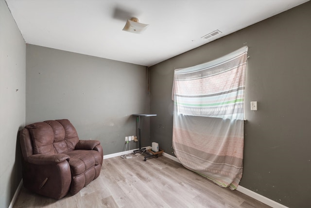 sitting room with light wood-type flooring