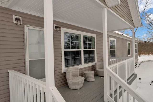 view of snow covered deck