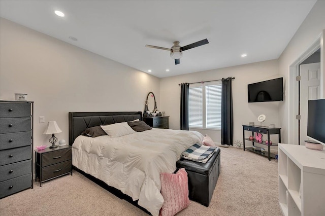 carpeted bedroom featuring ceiling fan