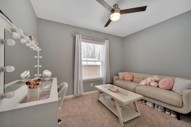 carpeted living room featuring ceiling fan