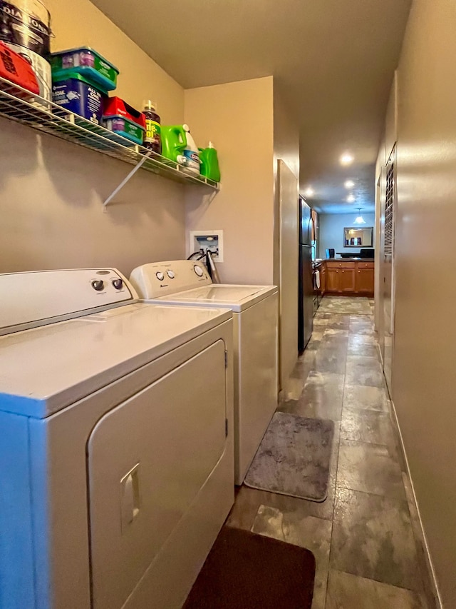 washroom with washer and clothes dryer