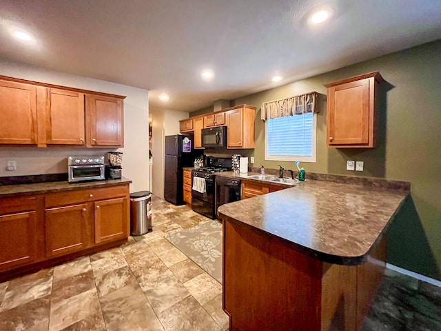 kitchen with black appliances, kitchen peninsula, and sink