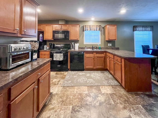 kitchen featuring sink and black appliances