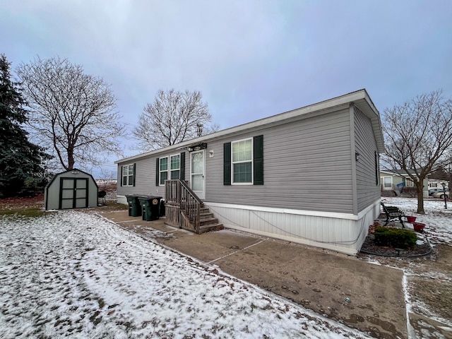 view of front of house featuring a storage shed