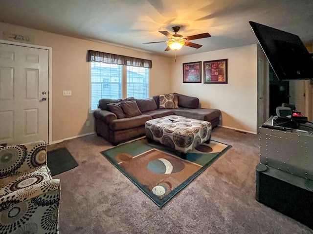 carpeted living room featuring ceiling fan