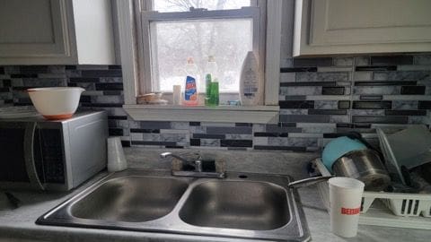 kitchen with sink and tasteful backsplash