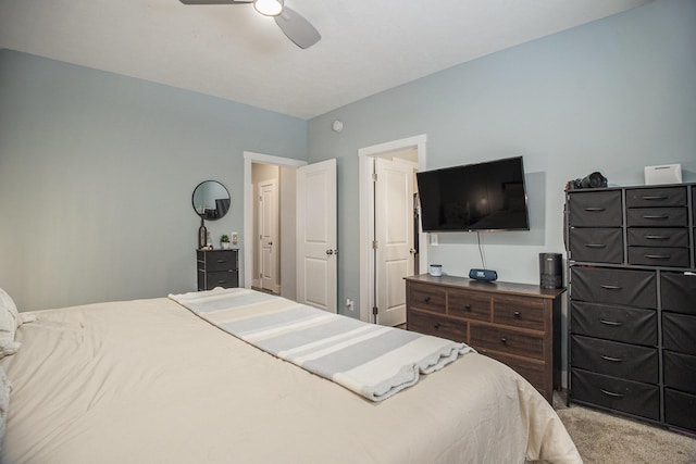 bedroom featuring light carpet and ceiling fan