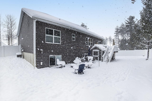 view of snow covered house