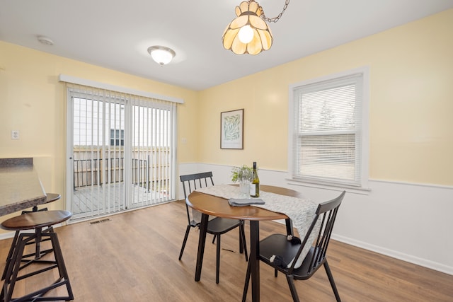 dining area with hardwood / wood-style floors