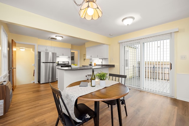 dining area with light hardwood / wood-style flooring