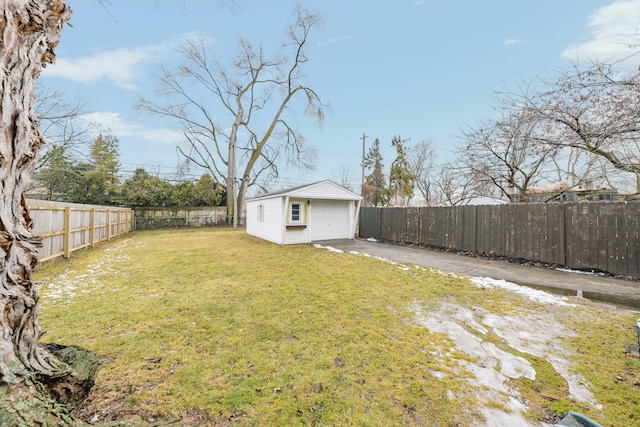 view of yard featuring an outbuilding and a garage