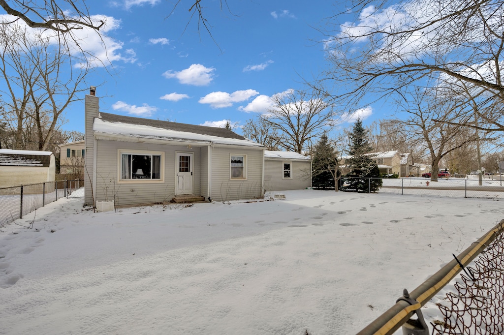 view of snow covered house