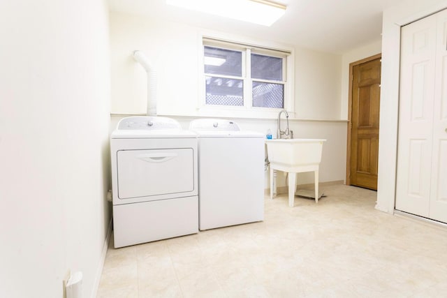 laundry area with washing machine and dryer