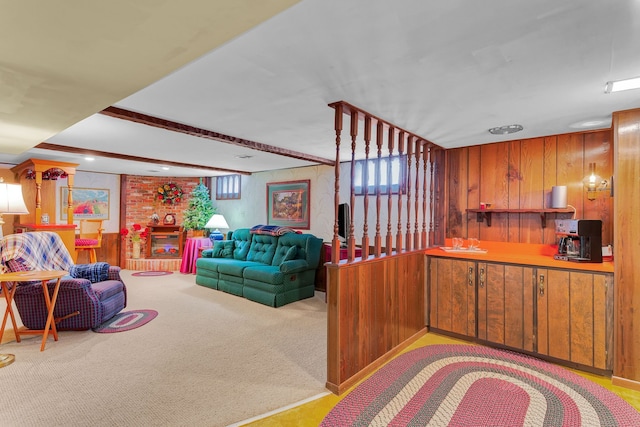 living room with wood walls and carpet