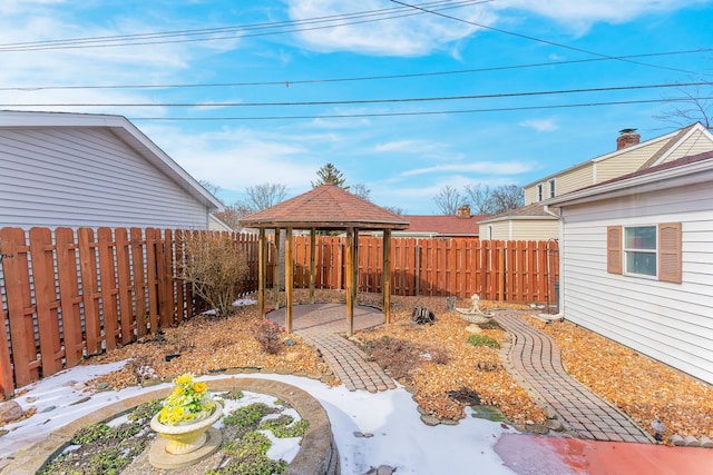 view of yard with a patio area, a fenced backyard, and a gazebo