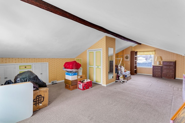 bonus room with lofted ceiling with beams, carpet, and wallpapered walls