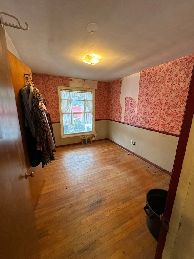 empty room with light hardwood / wood-style floors