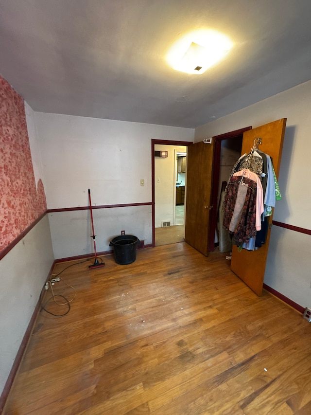 bedroom with hardwood / wood-style floors