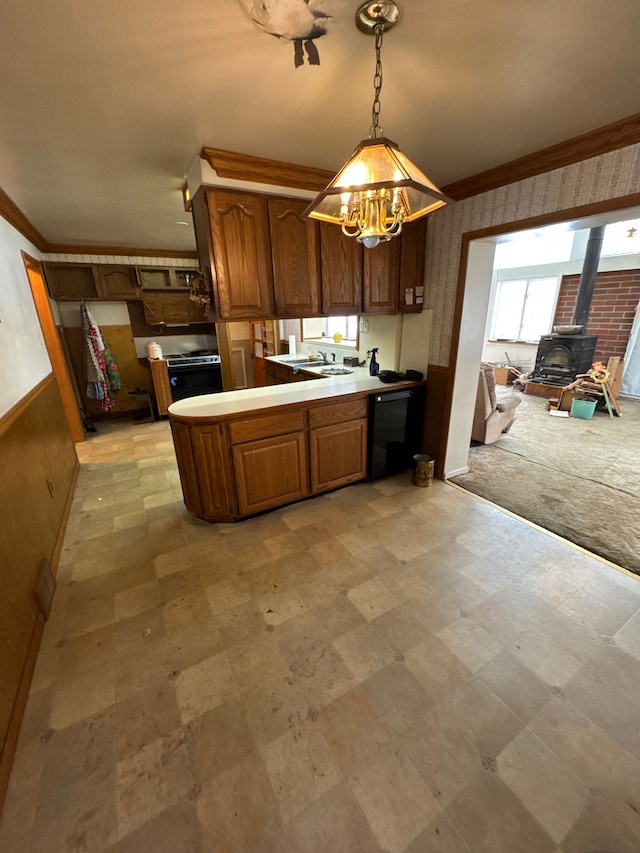 kitchen featuring crown molding, decorative light fixtures, black dishwasher, kitchen peninsula, and light colored carpet