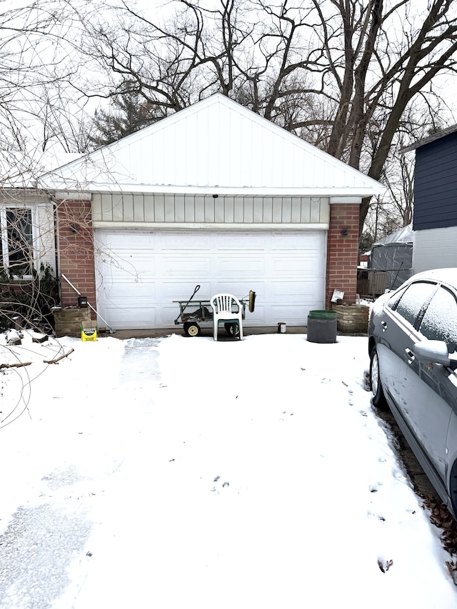 view of snow covered garage