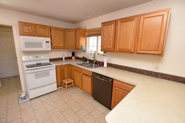 kitchen with sink and white appliances