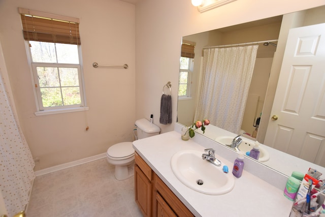 bathroom featuring walk in shower, vanity, and toilet