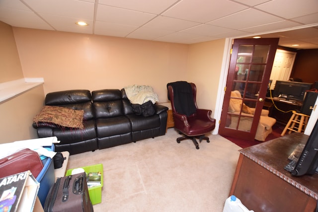 living room featuring french doors and carpet