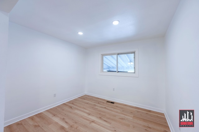 unfurnished room with light hardwood / wood-style floors