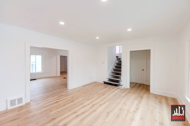 spare room featuring light wood-type flooring