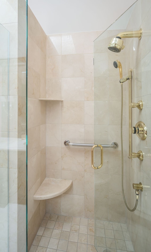 bathroom with a shower with shower door