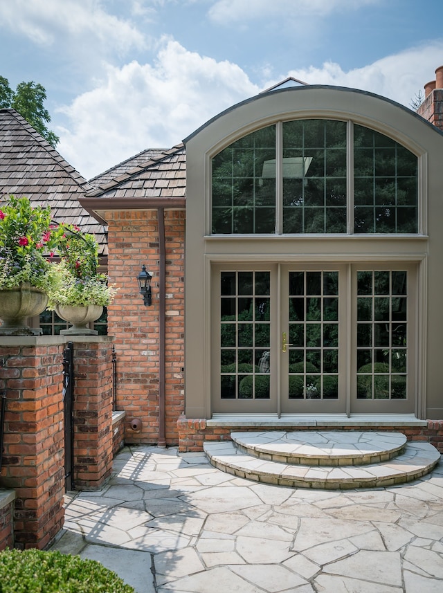 entrance to property with a patio and french doors