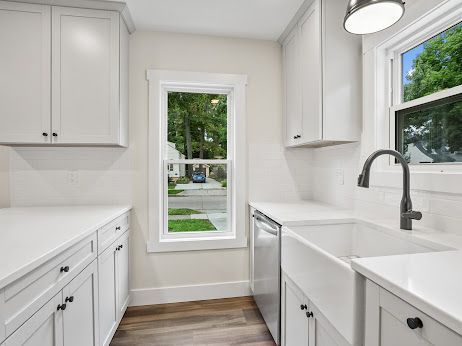 kitchen featuring white cabinetry and a wealth of natural light