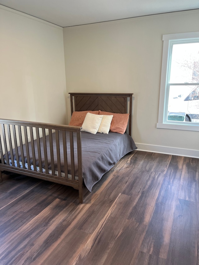 unfurnished bedroom with dark hardwood / wood-style flooring