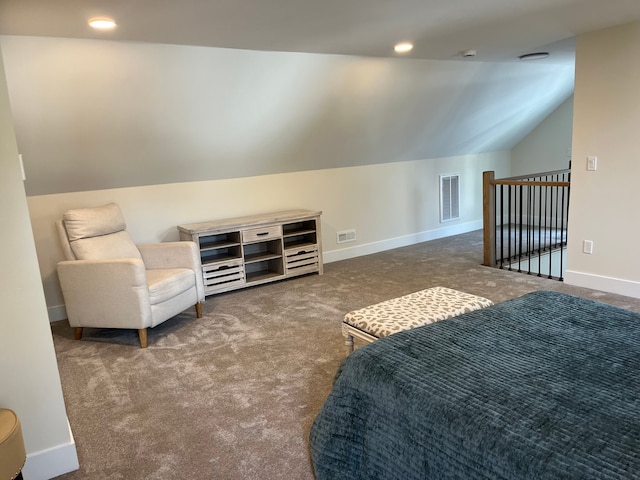 bedroom featuring dark colored carpet and vaulted ceiling