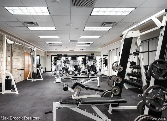 gym featuring a drop ceiling