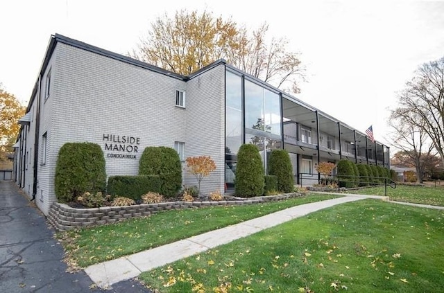 view of home's exterior with a yard