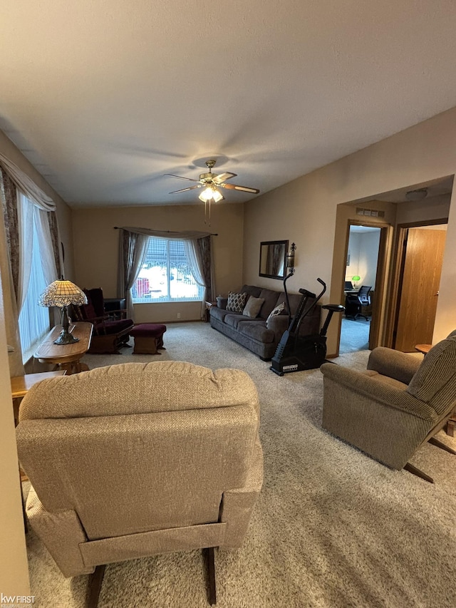 living room with carpet flooring and ceiling fan