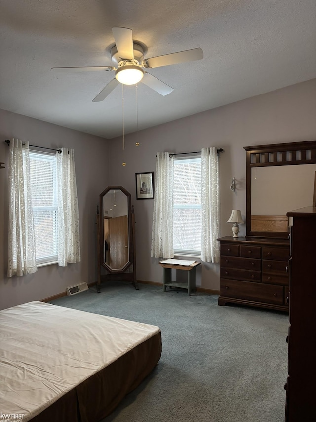 bedroom featuring light colored carpet and ceiling fan