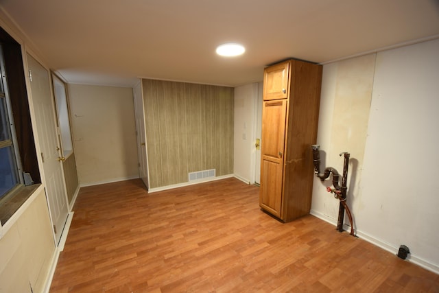 spare room featuring light hardwood / wood-style floors