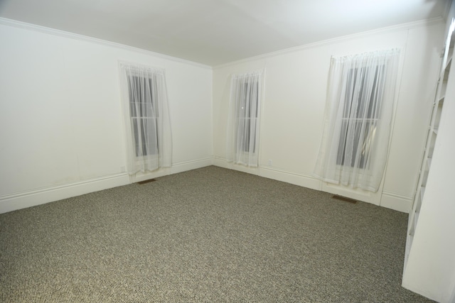 carpeted empty room with crown molding