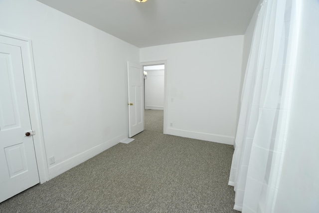 empty room featuring light colored carpet