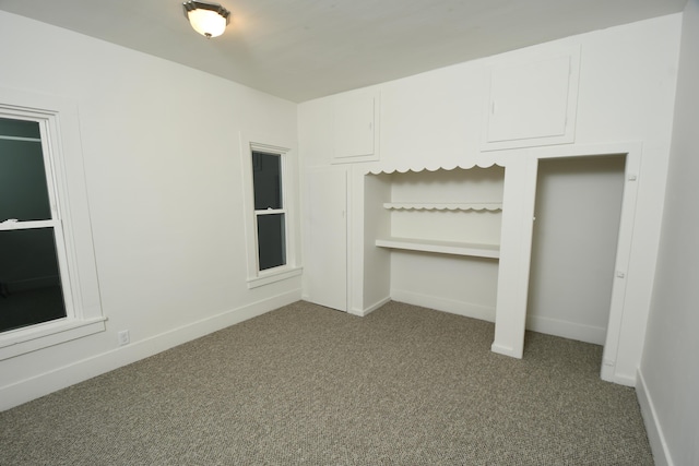 unfurnished bedroom featuring carpet floors and a closet